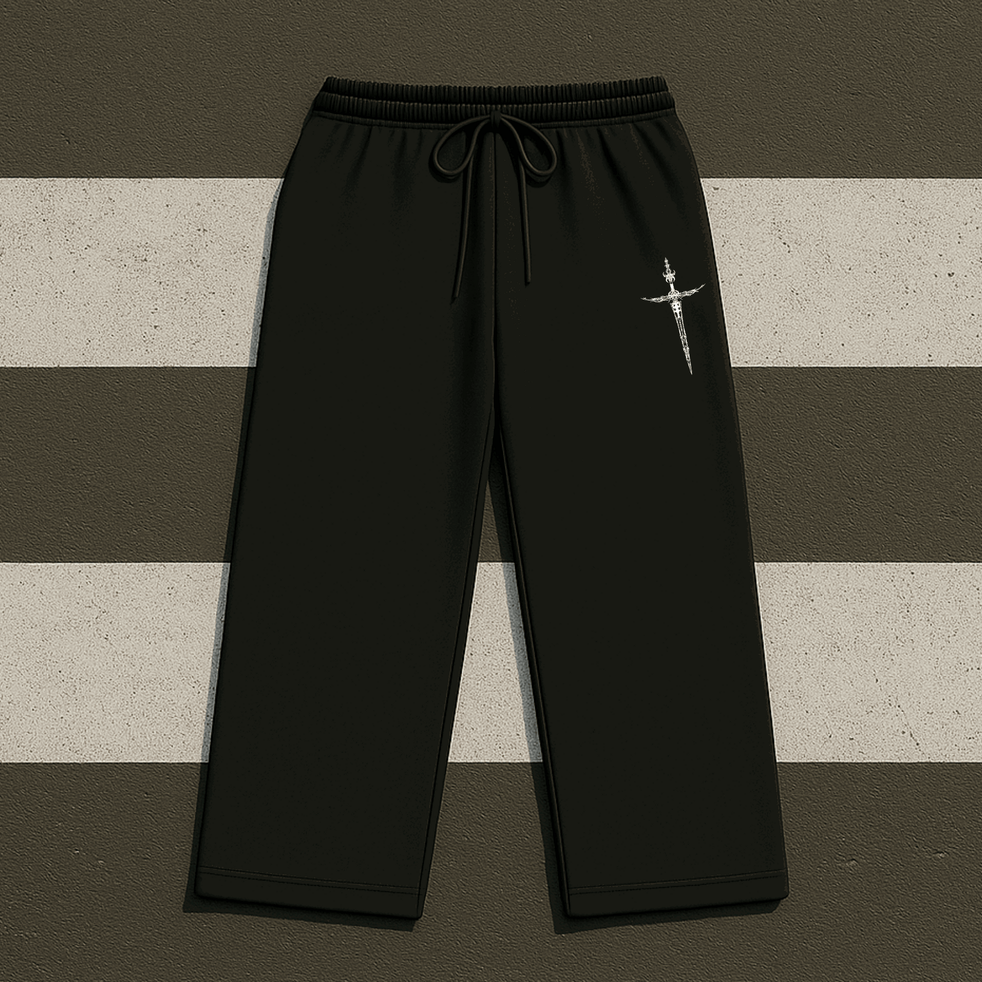 Black pants with a white logo on a striped background