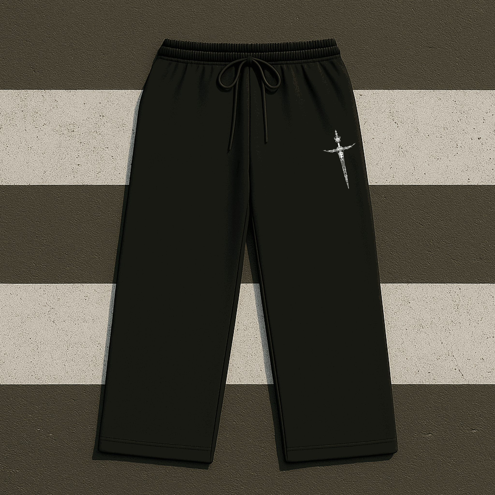 Black pants with a white logo on a striped background