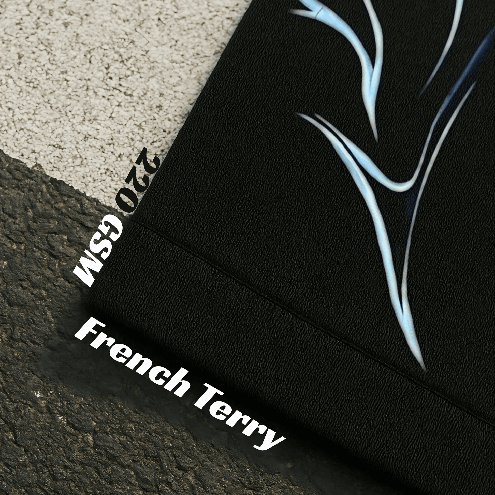 Black fabric with abstract blue design and text on a textured surface