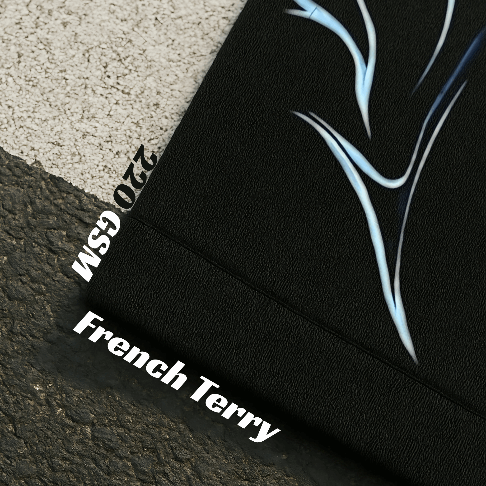 Black fabric with abstract blue design and text on a textured surface