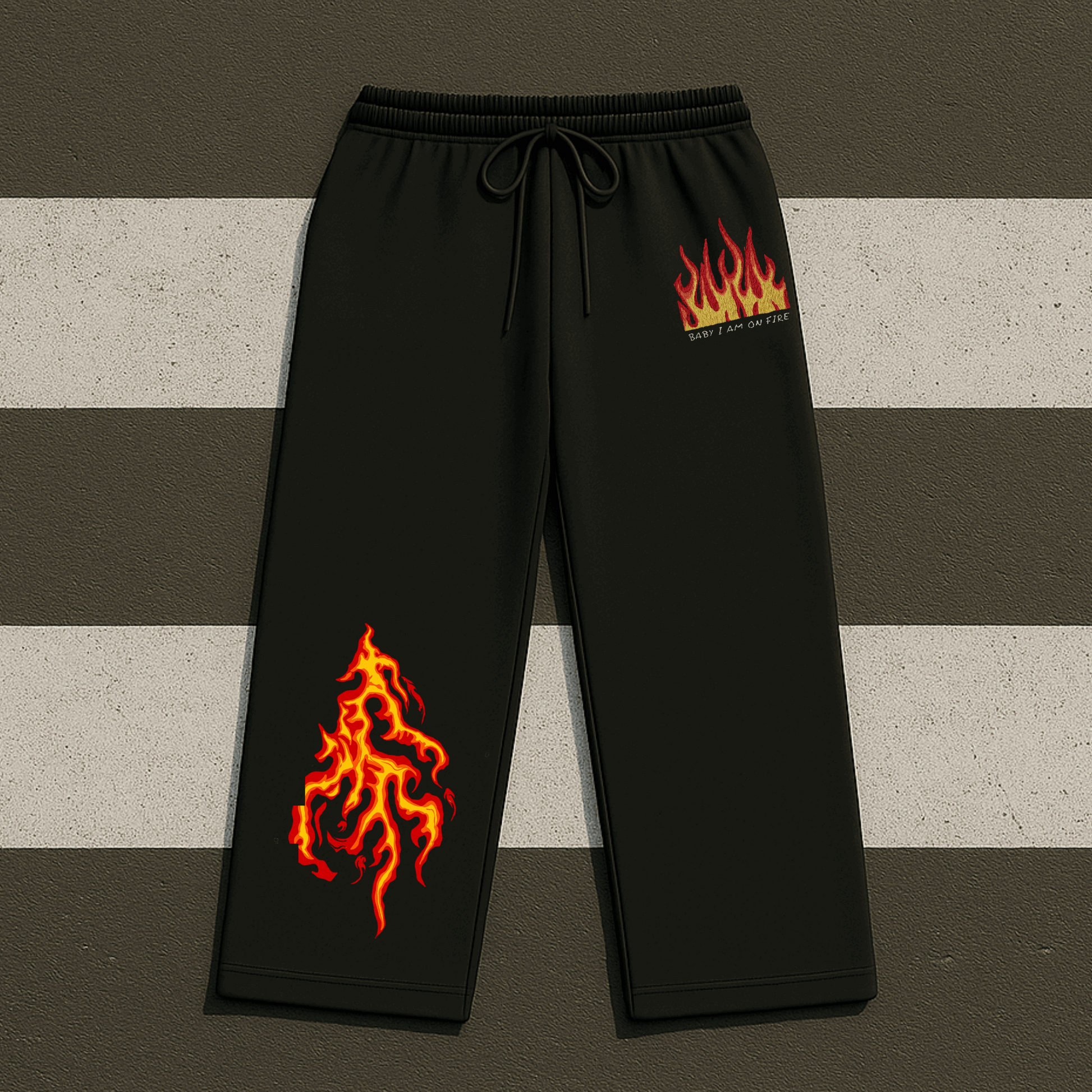 Black pants with flame designs on a striped background