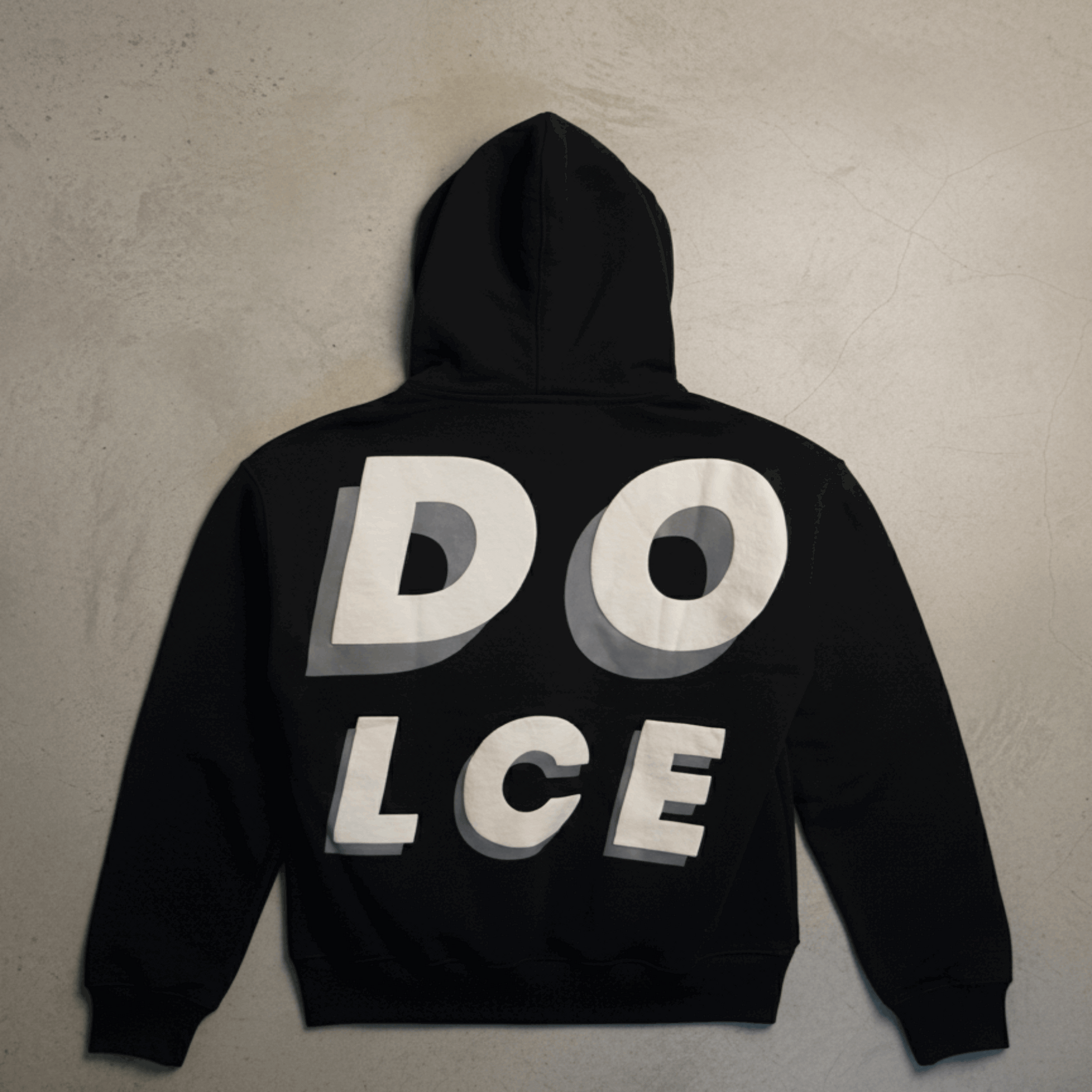 Black hoodie with 'DOLCE' text on the back against a beige background