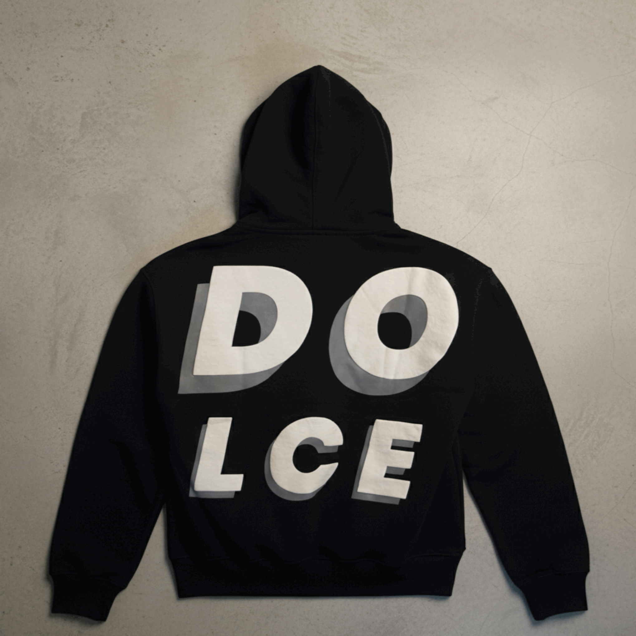 Black hoodie with 'DOLCE' text on the back against a beige background