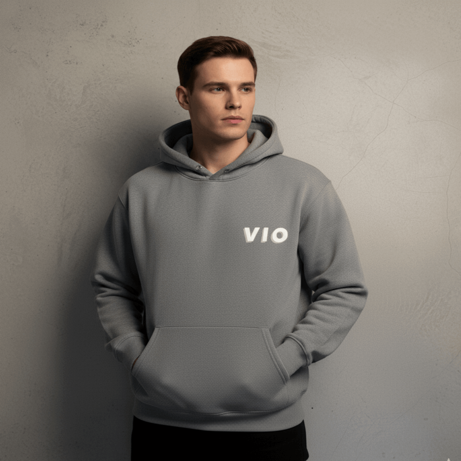 Person wearing a gray hoodie with 'VIO' logo against a plain background