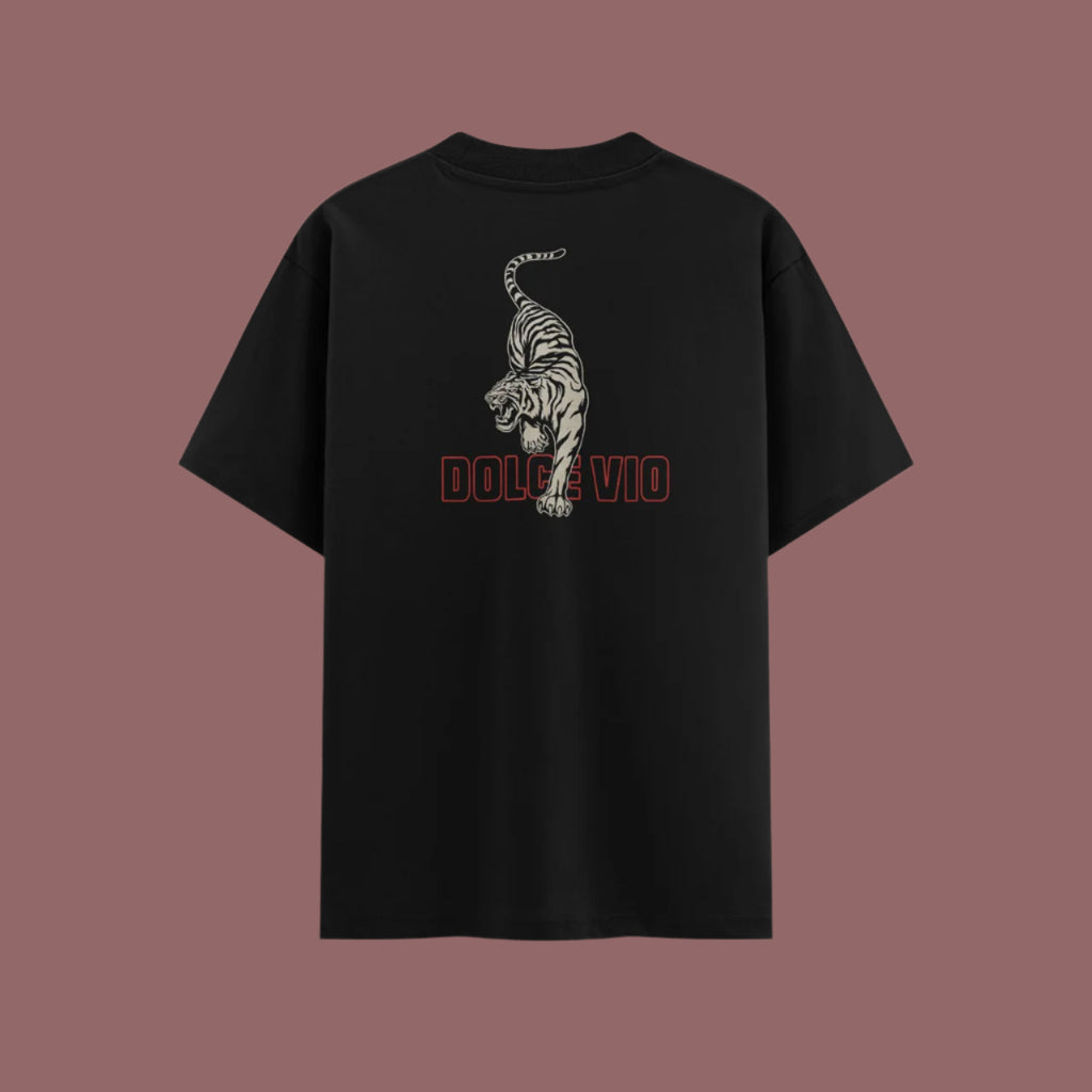 Black t-shirt with a tiger design and 'DOLCE VIO' text on the back against a brown background
