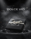 Black gift box with white ribbon and 'DOLCE VIO' branding on a dark background